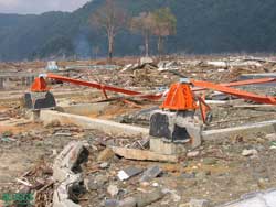 steel beams bent over by the force of the tsunami